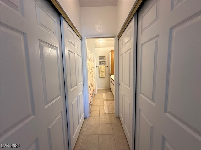 hallway with light tile patterned floors