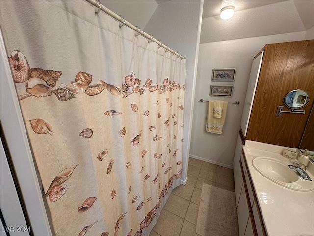 bathroom with tile patterned floors and vanity