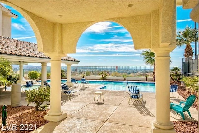 view of patio featuring a community pool