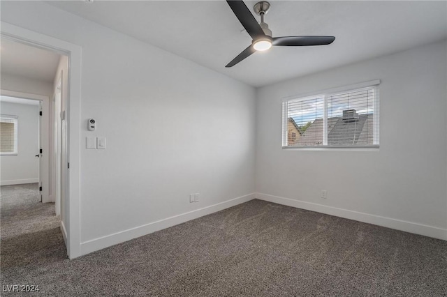 unfurnished room featuring ceiling fan and carpet flooring