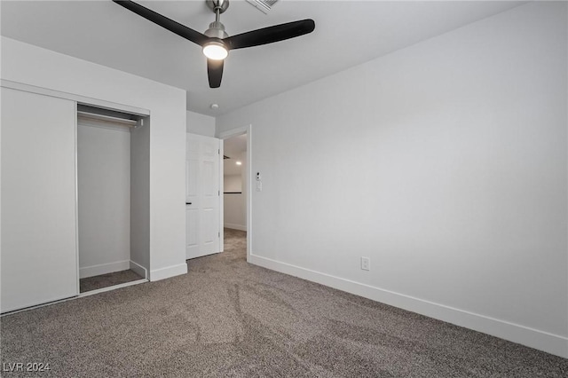 unfurnished bedroom with carpet floors, ceiling fan, and a closet