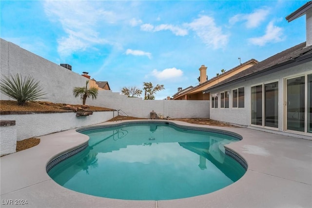 view of swimming pool featuring a patio area