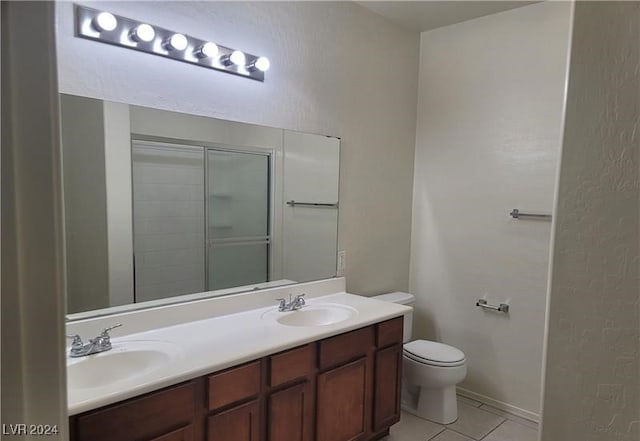 bathroom featuring tile patterned flooring, vanity, and toilet