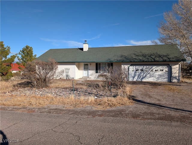 ranch-style house featuring a garage