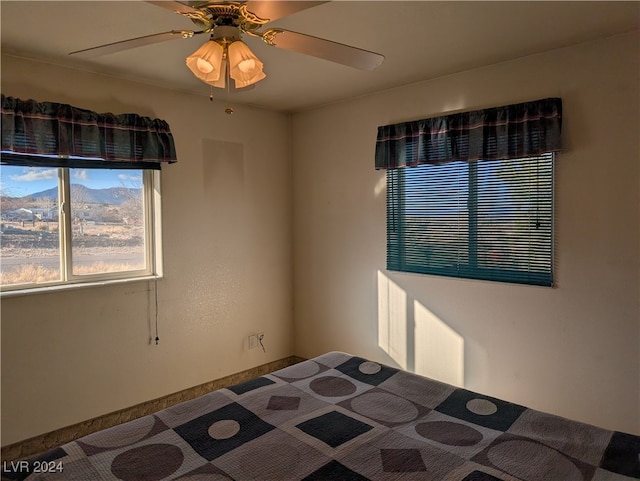 unfurnished bedroom featuring ceiling fan