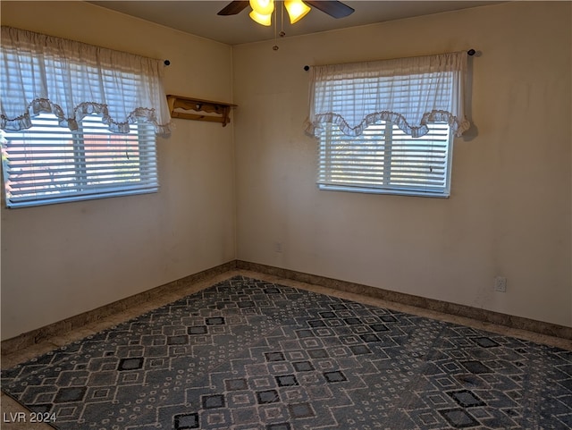 spare room with ceiling fan