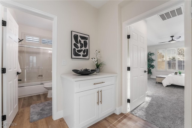 corridor featuring light hardwood / wood-style floors