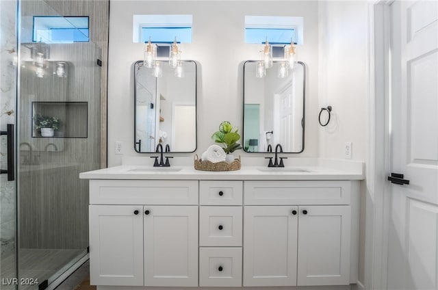 bathroom featuring vanity and a shower with shower door