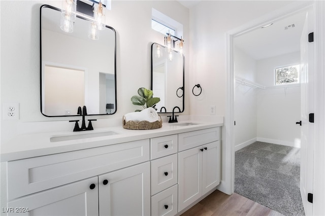 bathroom featuring vanity and hardwood / wood-style flooring