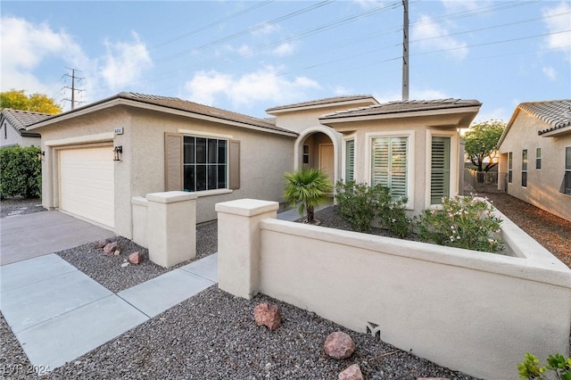 view of front of property with a garage