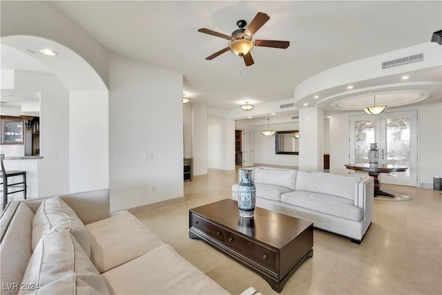 living room with ceiling fan and french doors