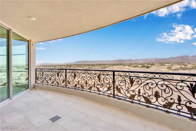 balcony featuring a mountain view