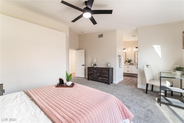 bedroom with ceiling fan and light colored carpet