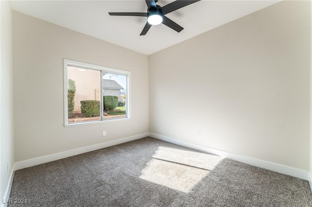 empty room featuring carpet floors and ceiling fan