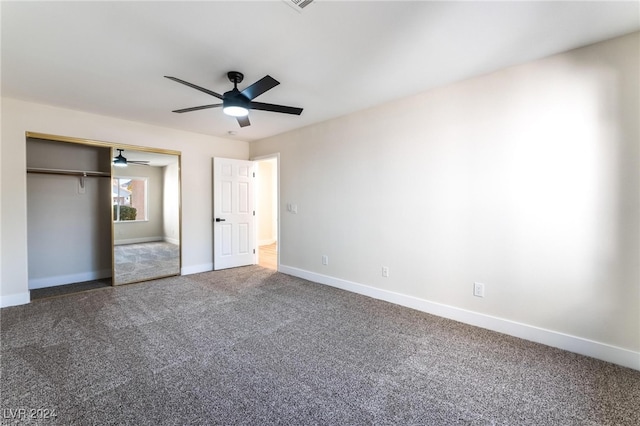 unfurnished bedroom featuring ceiling fan, a closet, and carpet floors