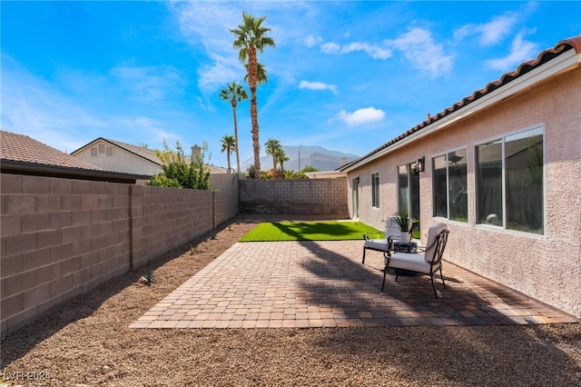 view of patio featuring a mountain view