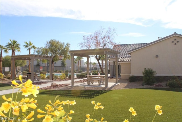 view of home's community with a patio and a pergola