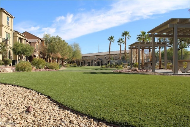 view of home's community featuring a lawn and a residential view