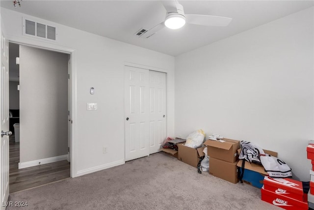 unfurnished bedroom featuring a closet, carpet, visible vents, and baseboards