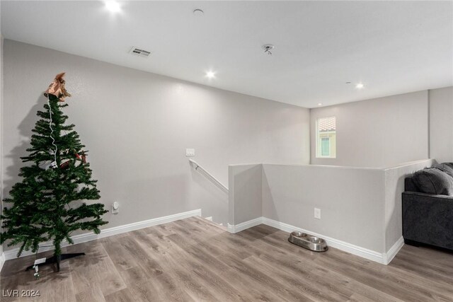 laundry area with light wood-type flooring