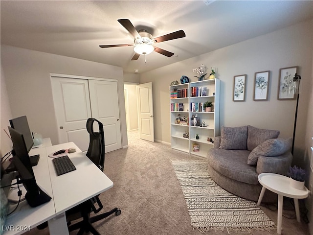 office with carpet and a ceiling fan