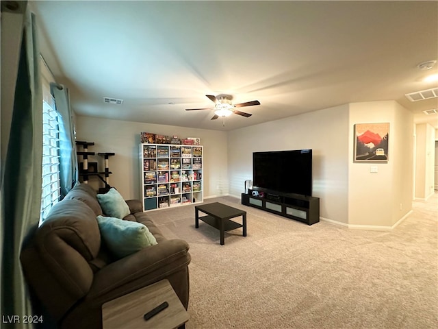 carpeted living room with a ceiling fan, visible vents, and baseboards