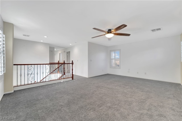 empty room with carpet and ceiling fan