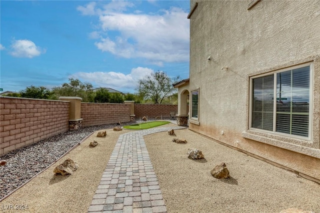 view of yard featuring a fenced backyard and a patio area