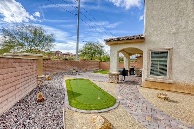 view of yard featuring a patio and a fenced backyard