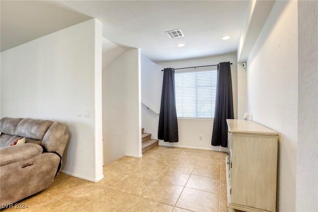 interior space with tile patterned floors, recessed lighting, baseboards, and visible vents