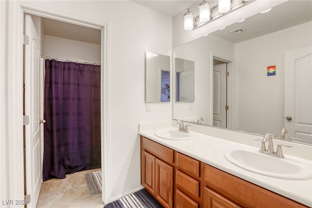 bathroom with tile patterned flooring, vanity, and a shower with shower curtain