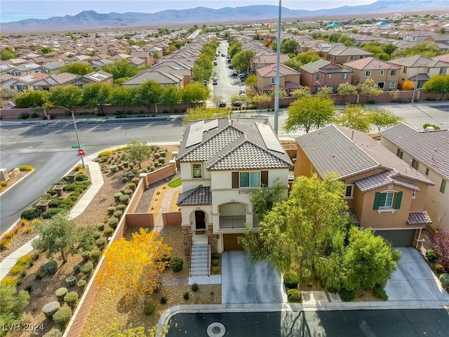 birds eye view of property featuring a mountain view and a residential view