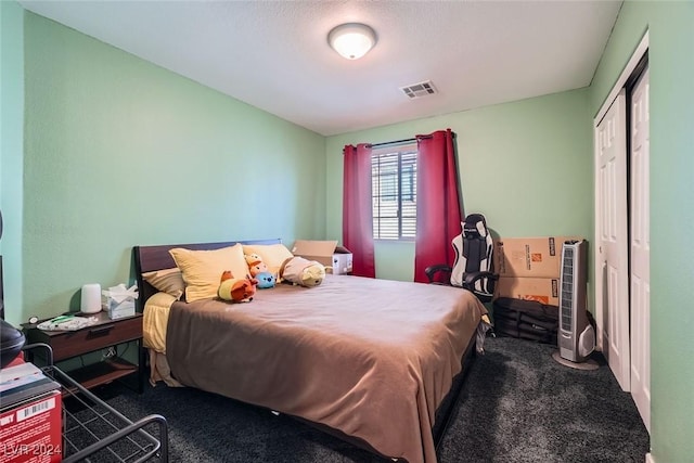 carpeted bedroom featuring a closet