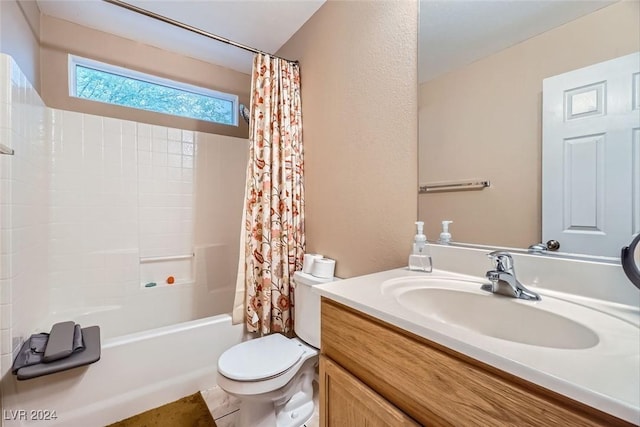 full bathroom featuring vanity, toilet, and shower / tub combo