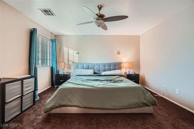 bedroom featuring ceiling fan and dark colored carpet