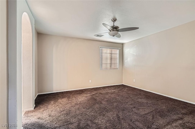 spare room featuring ceiling fan and carpet flooring