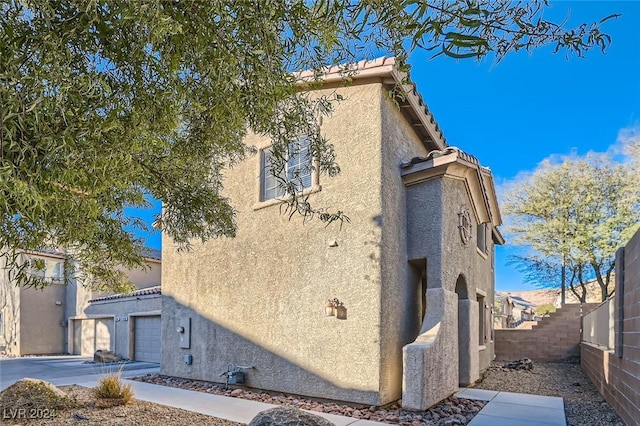 view of home's exterior with a garage