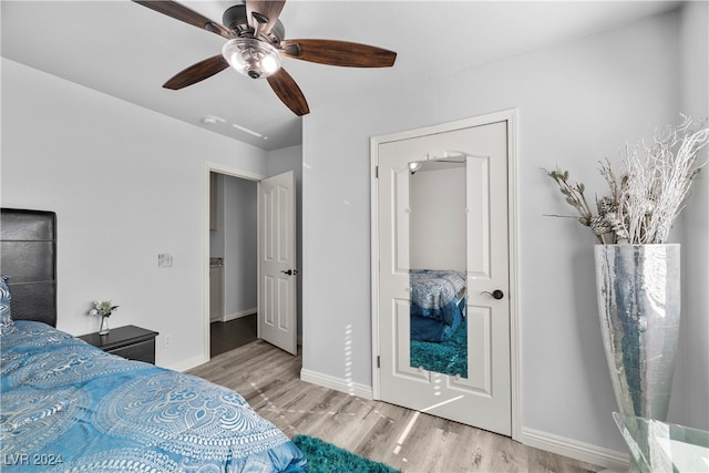 bedroom with light wood-type flooring and ceiling fan