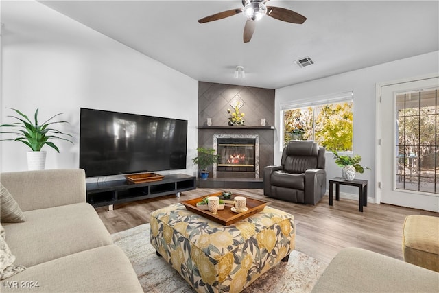 living room with wood-type flooring and ceiling fan