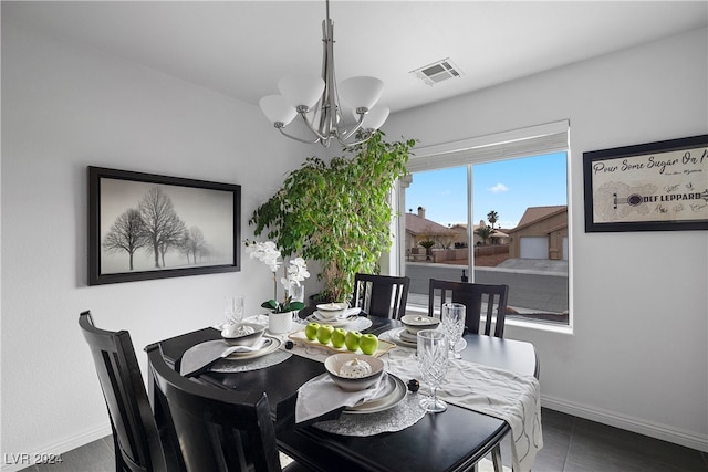 dining room with a notable chandelier