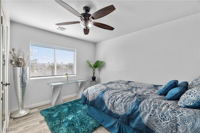 bedroom featuring ceiling fan and wood-type flooring