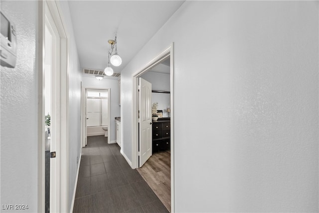 hall with dark hardwood / wood-style floors