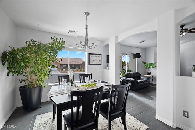 dining area featuring ceiling fan with notable chandelier and a wealth of natural light