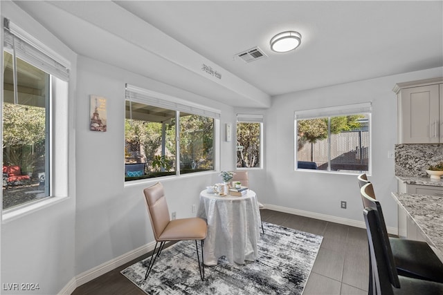 dining space featuring dark hardwood / wood-style flooring