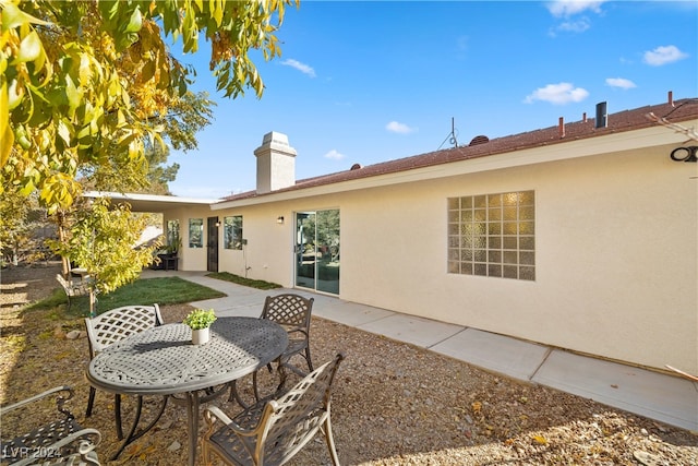 rear view of house featuring a patio area