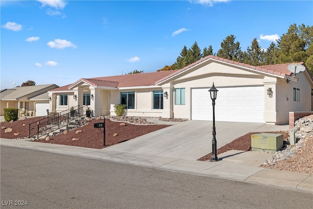 ranch-style house featuring a garage