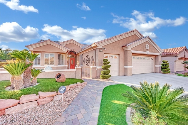 mediterranean / spanish-style home featuring a garage