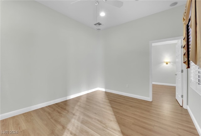 spare room with ceiling fan and light hardwood / wood-style floors