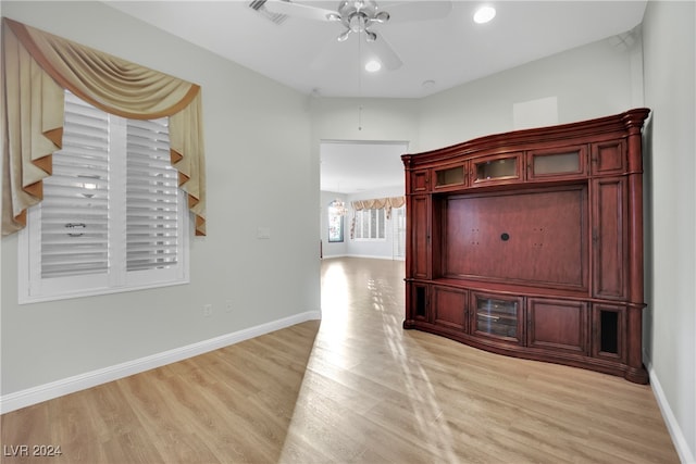 hallway with light hardwood / wood-style flooring