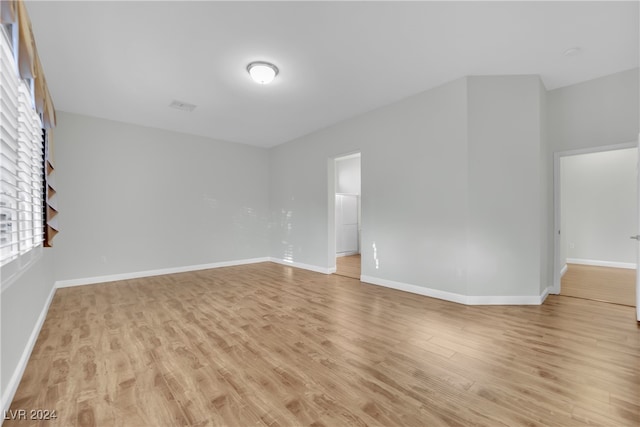 unfurnished room featuring light hardwood / wood-style floors